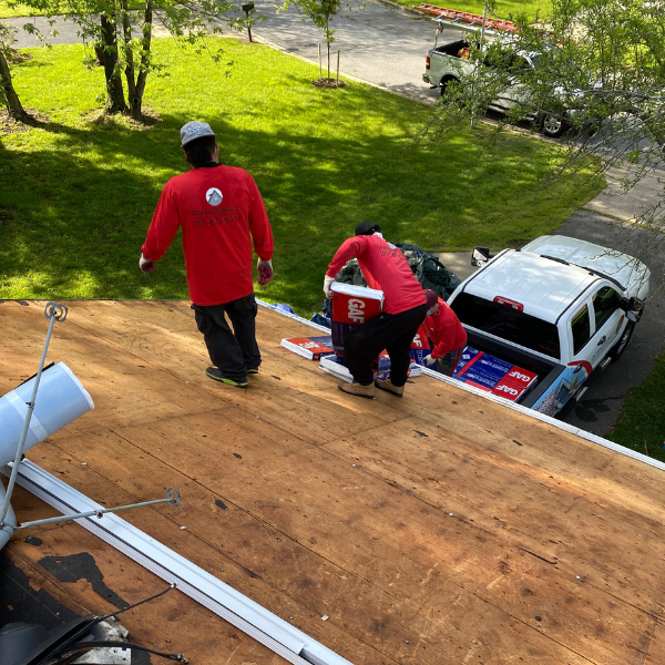 CS1 Construction crew loading GAF roofing materials during a residential re-roof in Maryland.